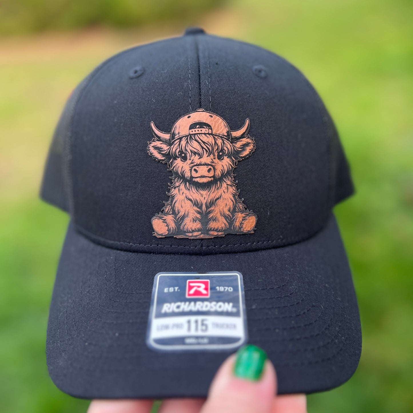 Highland Cow with hat on Richardson 115 Trucker Hat